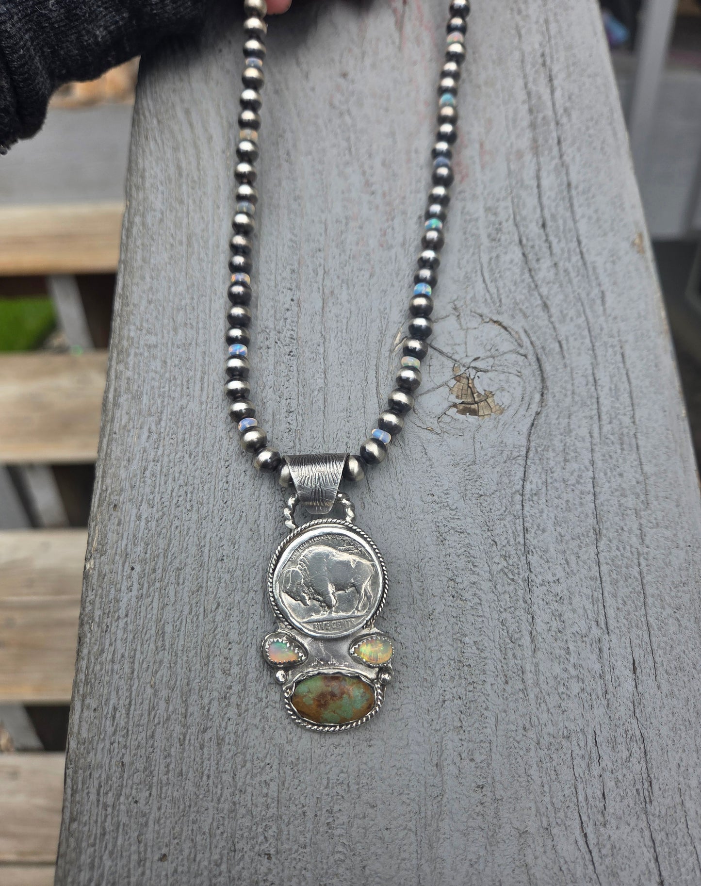 Buffalo coin with Sonoran Turquoise and Ethiopian Pearl on 6mm Navajo Style Pearls with Ethiopian Pearls . Can remove pendant. 16 1/2 inches.