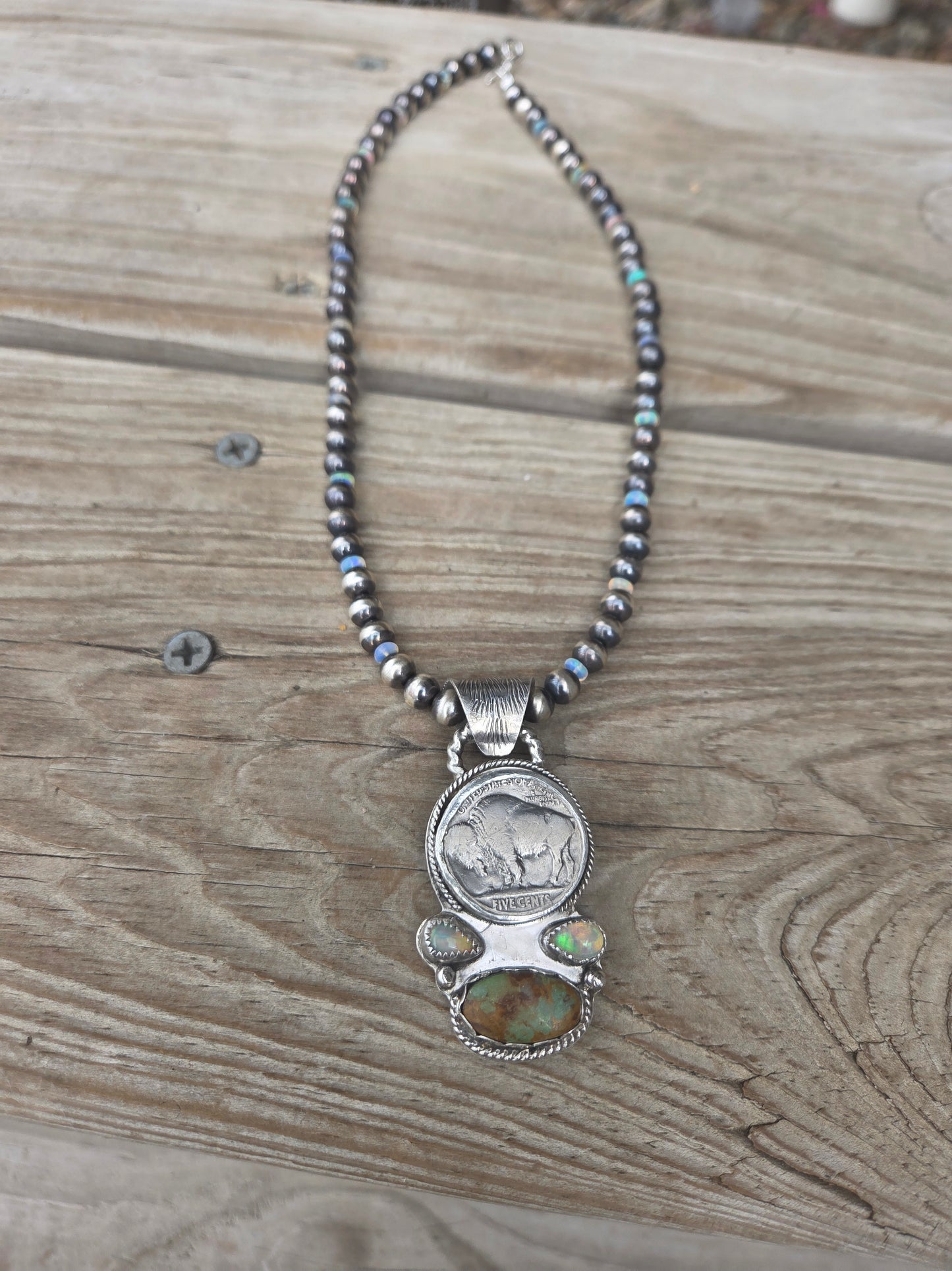Buffalo coin with Sonoran Turquoise and Ethiopian Pearl on 6mm Navajo Style Pearls with Ethiopian Pearls . Can remove pendant. 16 1/2 inches.