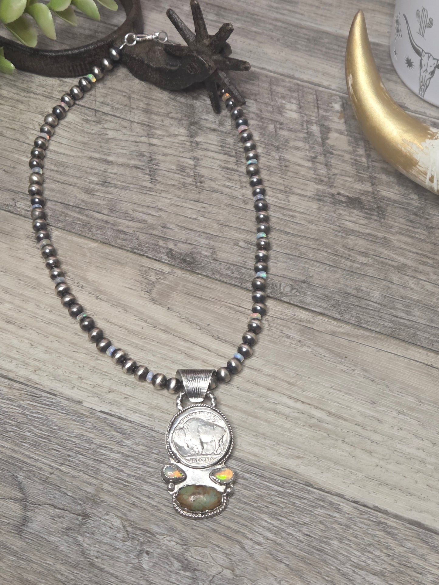 Buffalo coin with Sonoran Turquoise and Ethiopian Pearl on 6mm Navajo Style Pearls with Ethiopian Pearls . Can remove pendant. 16 1/2 inches.
