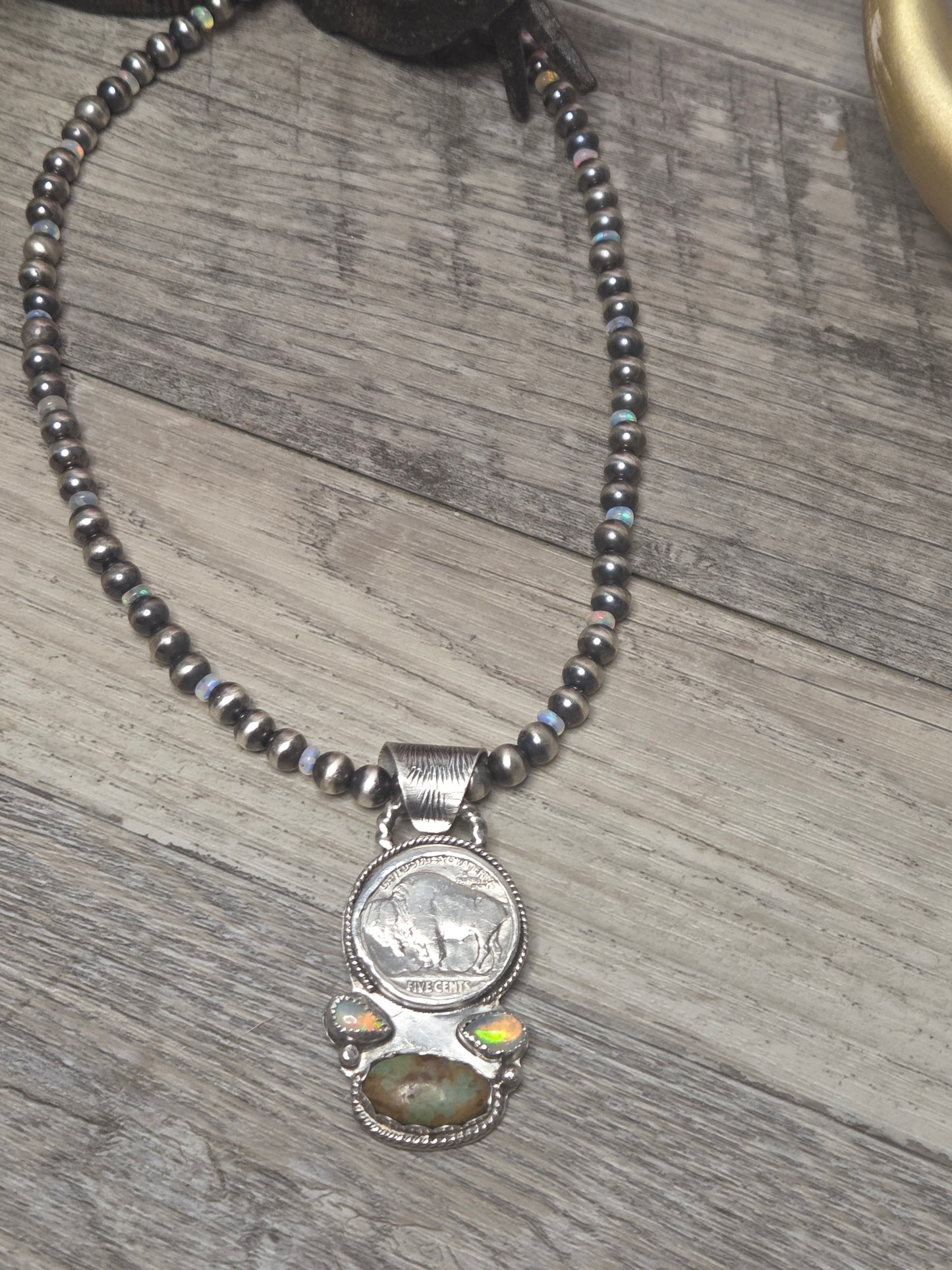 Buffalo coin with Sonoran Turquoise and Ethiopian Pearl on 6mm Navajo Style Pearls with Ethiopian Pearls . Can remove pendant. 16 1/2 inches.
