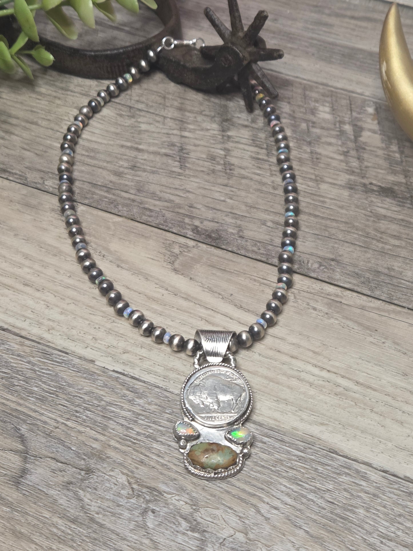 Buffalo coin with Sonoran Turquoise and Ethiopian Pearl on 6mm Navajo Style Pearls with Ethiopian Pearls . Can remove pendant. 16 1/2 inches.