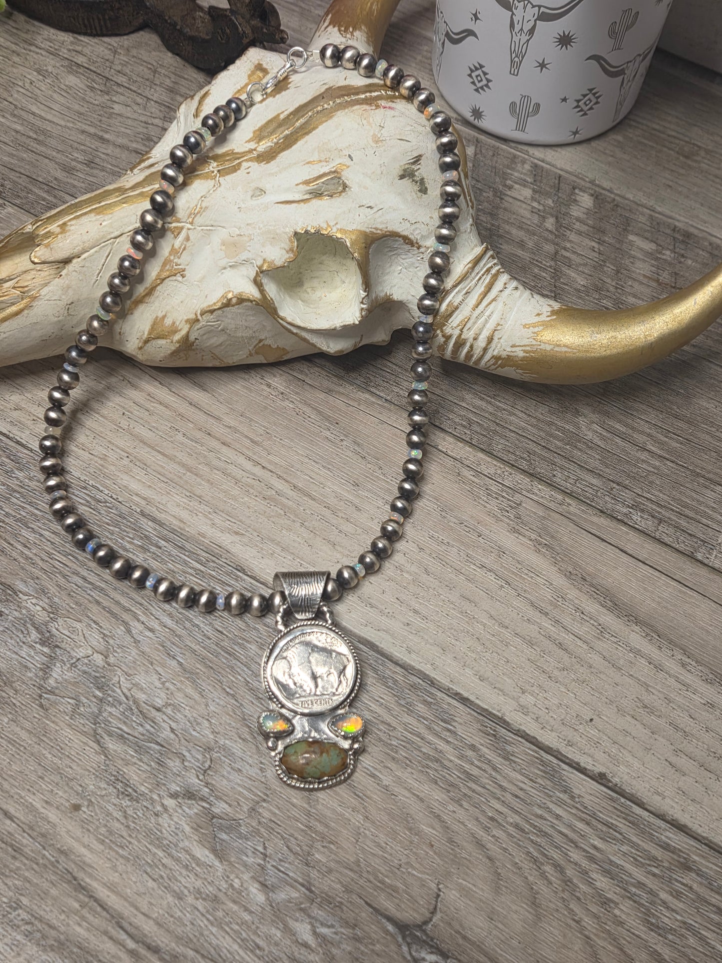 Buffalo coin with Sonoran Turquoise and Ethiopian Pearl on 6mm Navajo Style Pearls with Ethiopian Pearls . Can remove pendant. 16 1/2 inches.