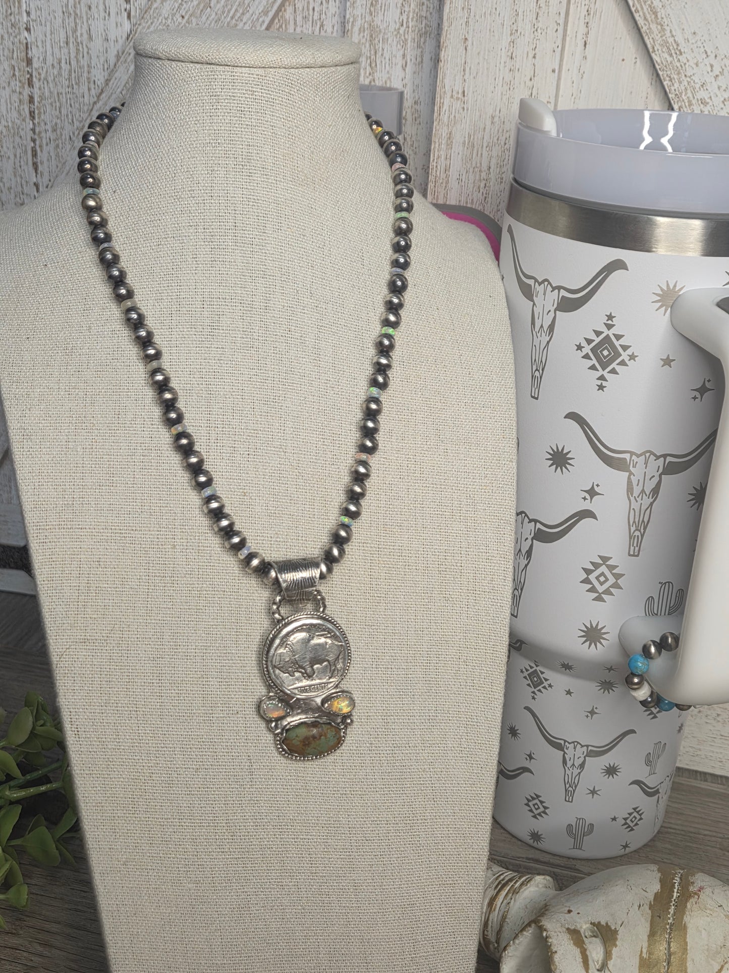 Buffalo coin with Sonoran Turquoise and Ethiopian Pearl on 6mm Navajo Style Pearls with Ethiopian Pearls . Can remove pendant. 16 1/2 inches.