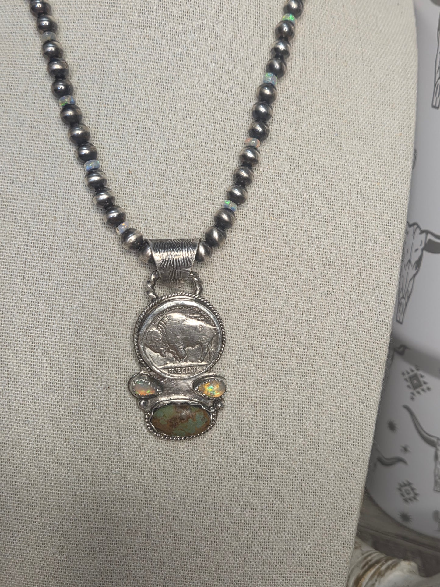 Buffalo coin with Sonoran Turquoise and Ethiopian Pearl on 6mm Navajo Style Pearls with Ethiopian Pearls . Can remove pendant. 16 1/2 inches.