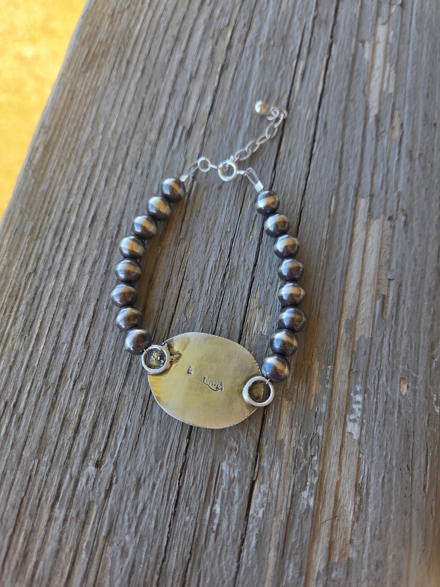 White Buffalo •Sterling Silver Navajo Style Pearl • Turquoise Sterling Silver Adjustable clasp. fits size 6-8