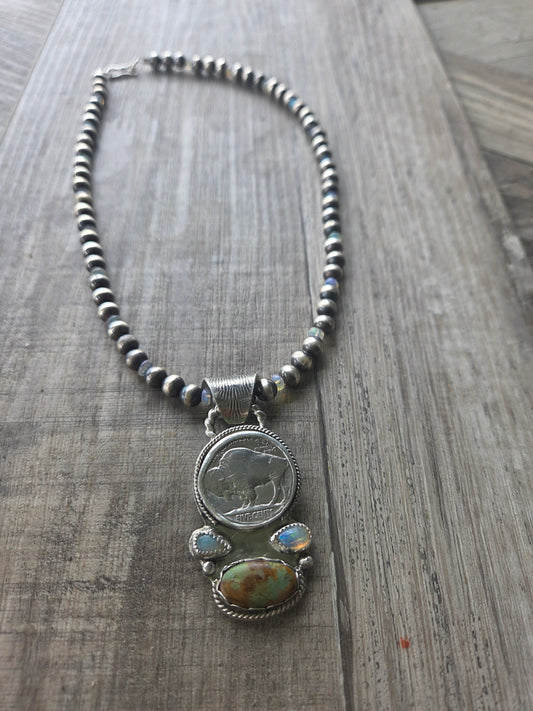 Buffalo coin with Sonoran Turquoise and Ethiopian Pearl  on 6mm Navajo Style Pearls with Ethiopian Pearls .  Can remove pendant.  16 1/2 inches.