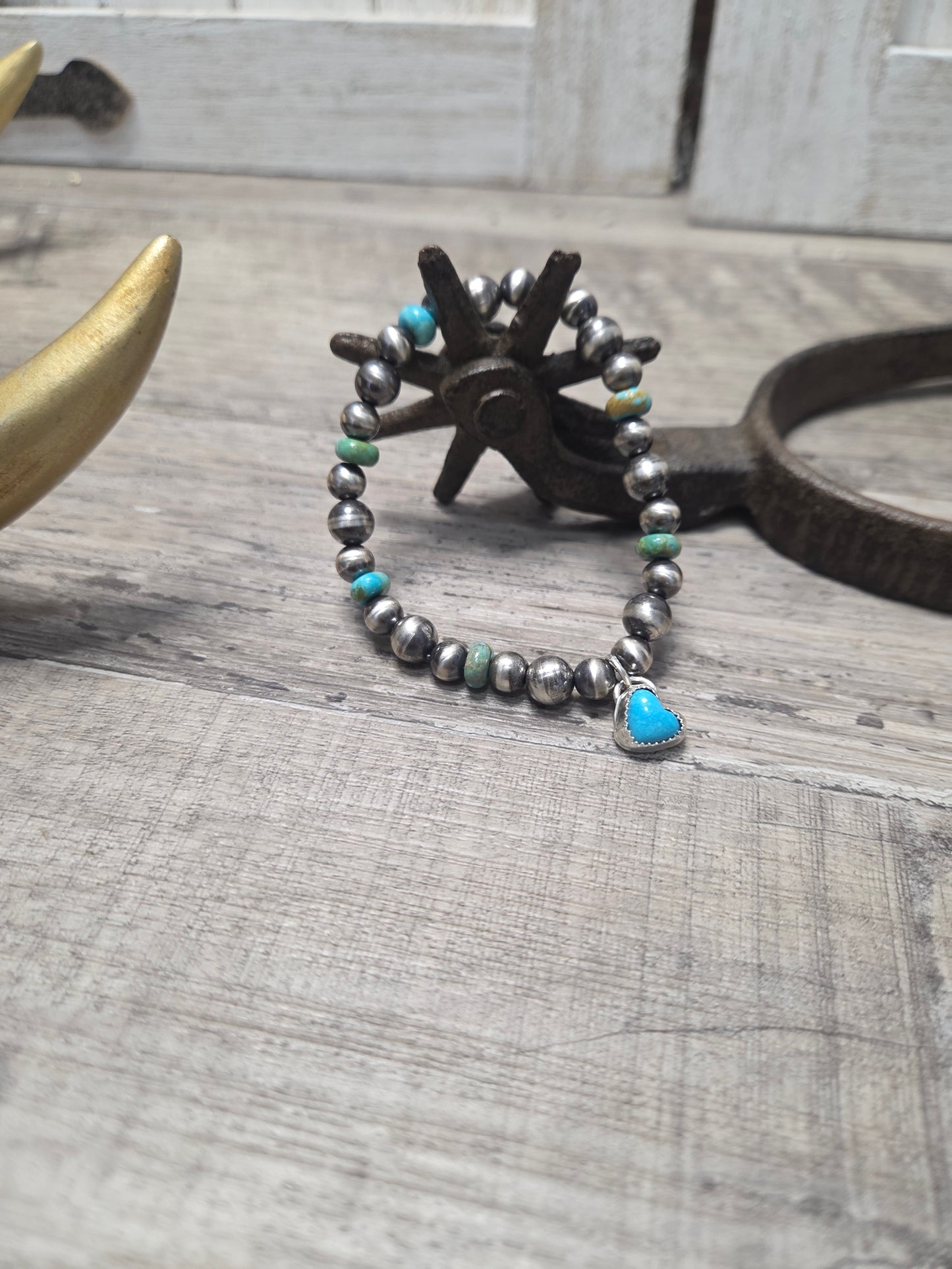 Kingsmen Turquoise Heart charm with Kingsmen Turquoise beads and Turquoise & Sterling Silver Navajo Style Pearls.  Stretch Bracelet