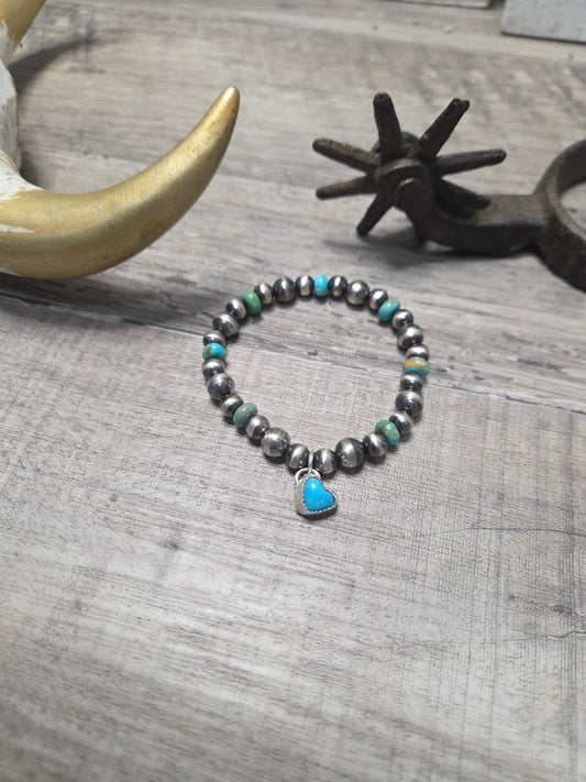 Kingsmen Turquoise Heart charm with Kingsmen Turquoise beads and Turquoise & Sterling Silver Navajo Style Pearls.  Stretch Bracelet