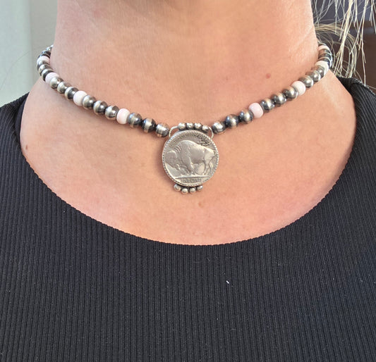 Buffalo Coin & pink conch
