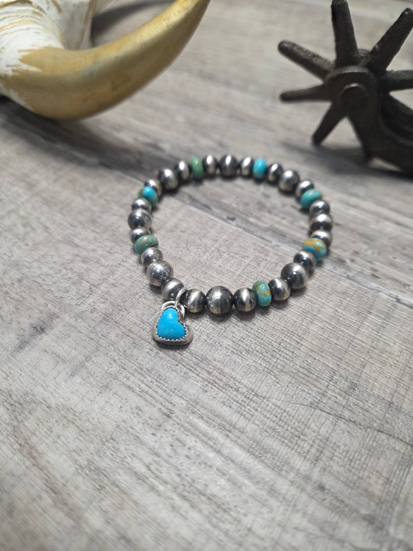 Kingsmen Turquoise Heart charm with Kingsmen Turquoise beads and Turquoise & Sterling Silver Navajo Style Pearls.  Stretch Bracelet